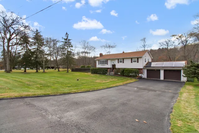 a view of a house with a big yard