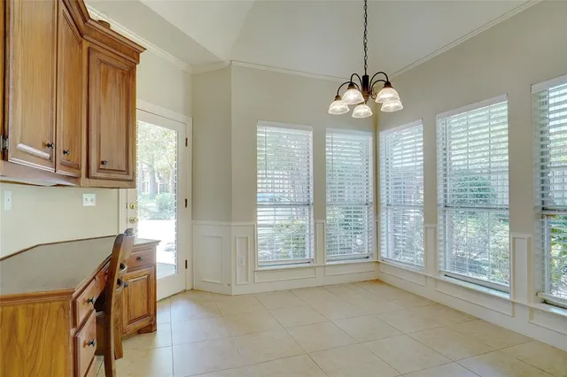 a view of a room with windows and chandelier