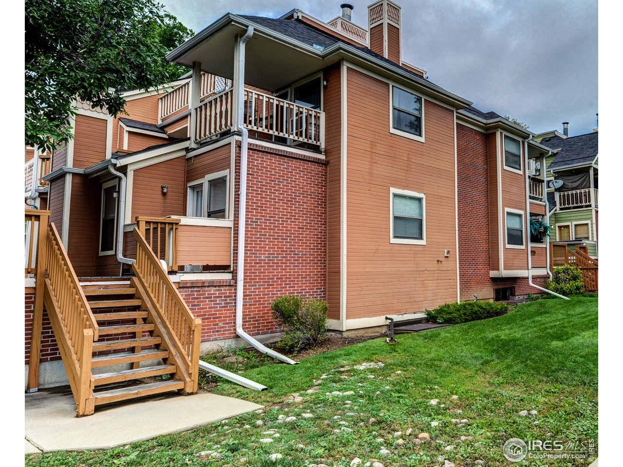 3025 Broadway, Unit 8 Boulder, CO 80304 - Photo 15 of 16 a front view of a house with a yard