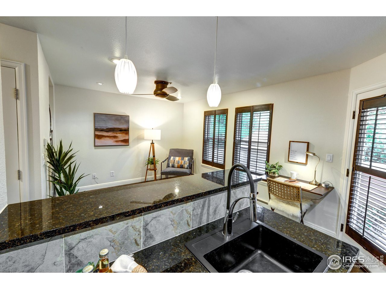 3025 Broadway, Unit 8 Boulder, CO 80304 - Photo 5 of 16 a living room with furniture and a flat screen tv