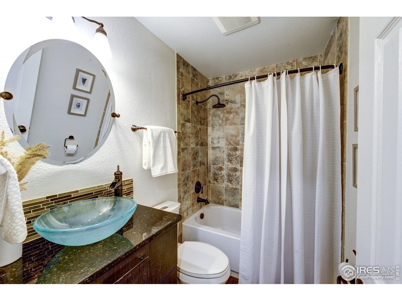 3025 Broadway, Unit 8 Boulder, CO 80304 - Photo 7 of 16 a bathroom with a sink toilet and shower