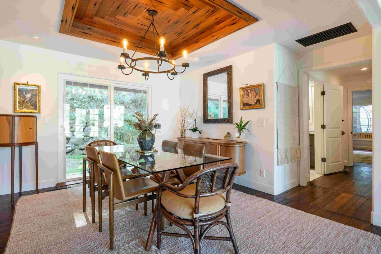 60 Los Ositos Road Carmel Valley, CA 93924 - Photo 12 of 47 a view of a dining room with furniture and wooden floor