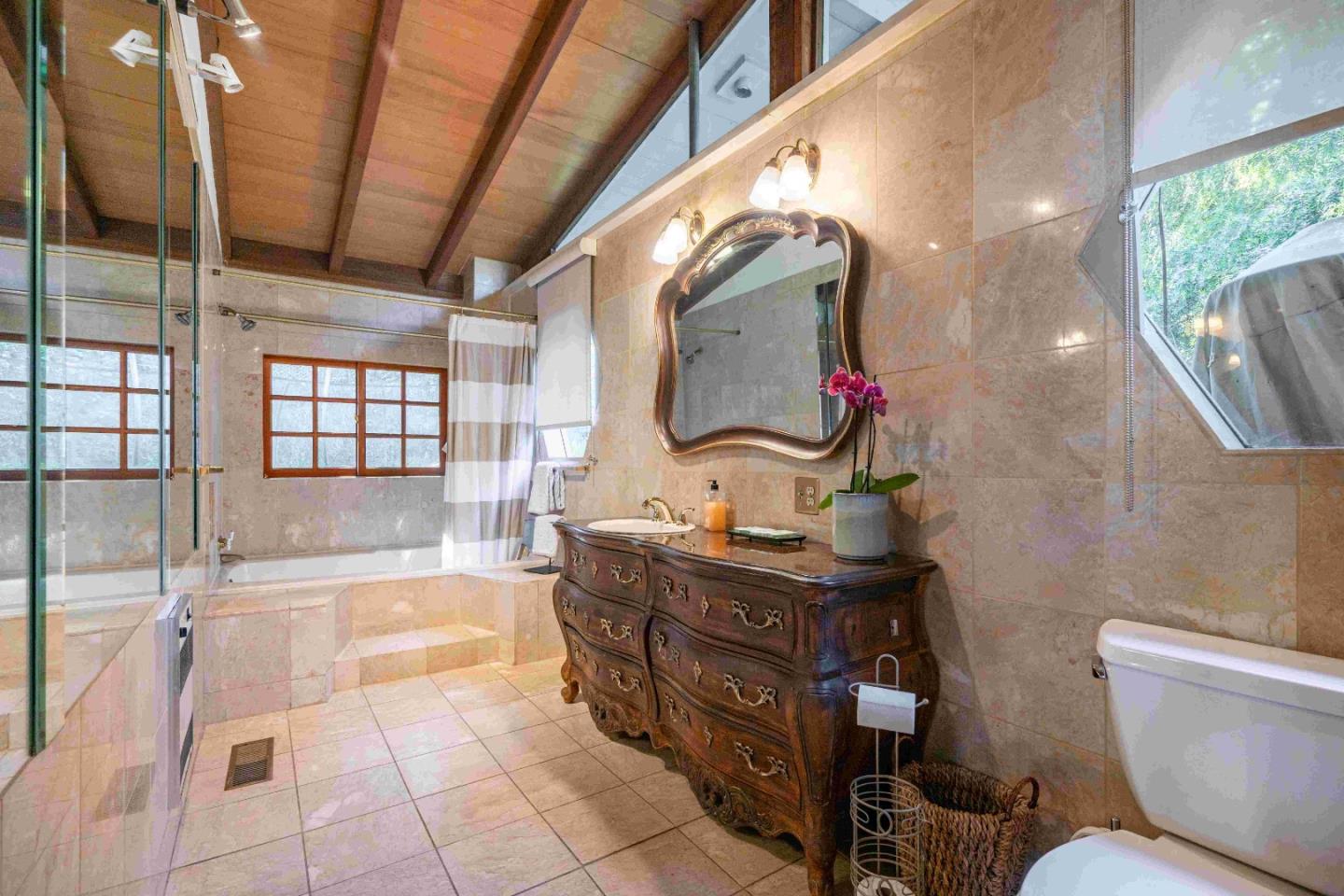 60 Los Ositos Road Carmel Valley, CA 93924 - Photo 15 of 47 a bathroom with a bathtub sink and mirror