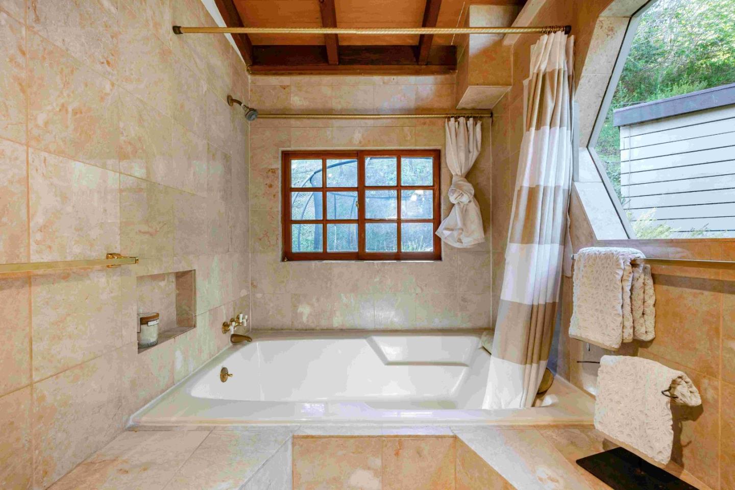 60 Los Ositos Road Carmel Valley, CA 93924 - Photo 16 of 47 a bathroom with a tub a sink and a shower