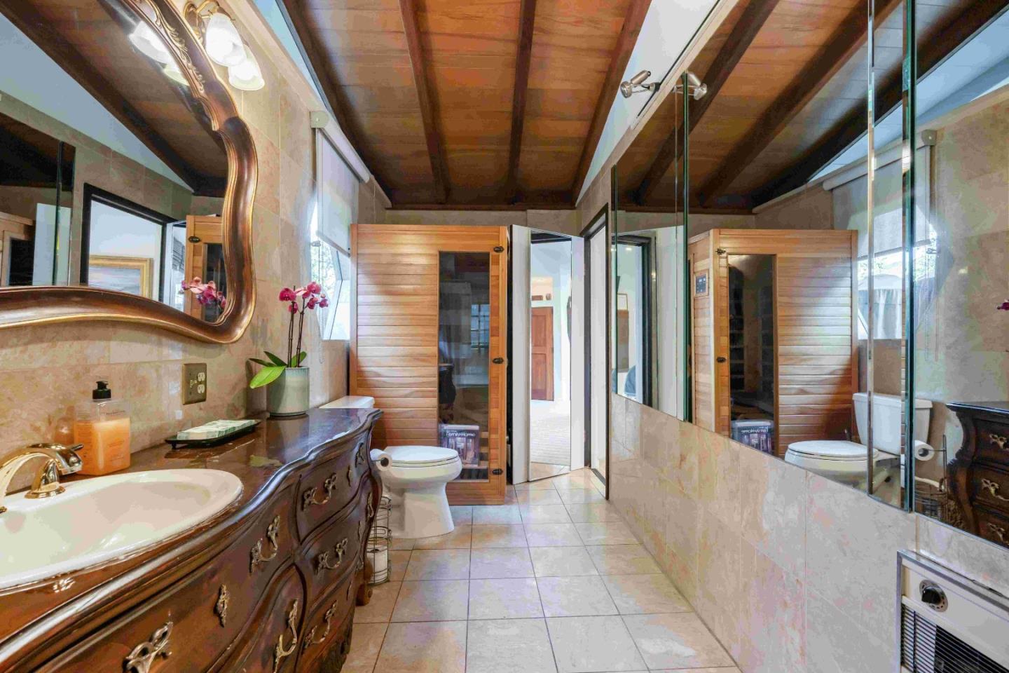 60 Los Ositos Road Carmel Valley, CA 93924 - Photo 17 of 47 a bathroom with a sink mirror vanity and toilet