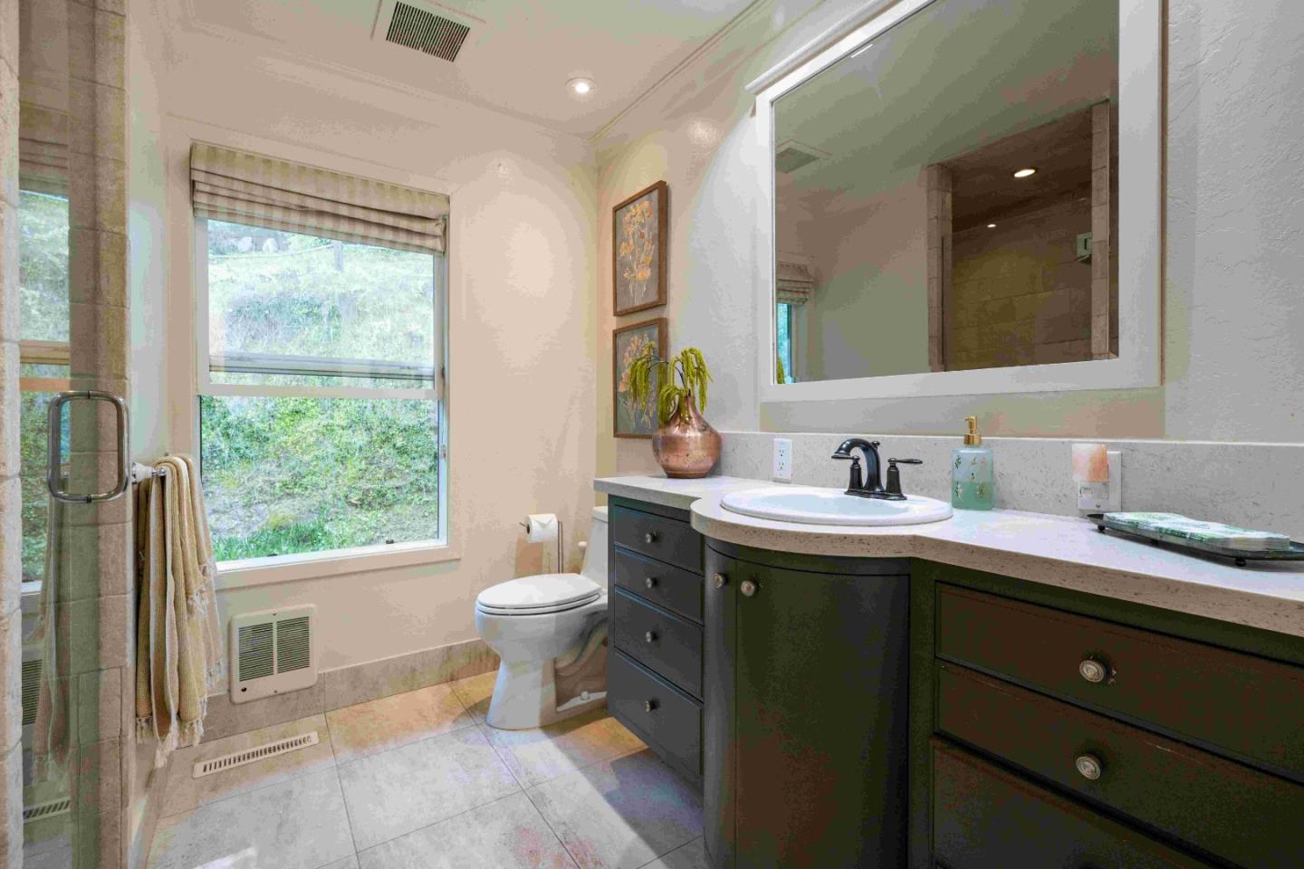 60 Los Ositos Road Carmel Valley, CA 93924 - Photo 19 of 47 a spacious bathroom with a granite countertop sink mirror and a window