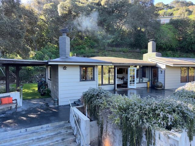 60 Los Ositos Road Carmel Valley, CA 93924 - Photo 20 of 47 a front view of a house with garden
