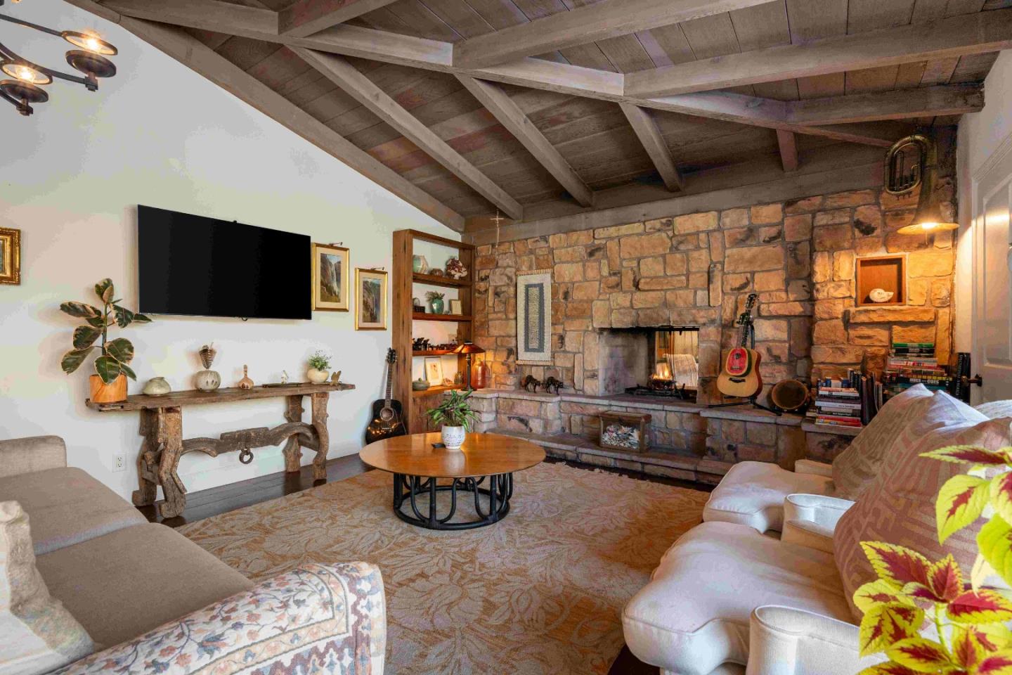 60 Los Ositos Road Carmel Valley, CA 93924 - Photo 2 of 47 a living room with furniture and a flat screen tv