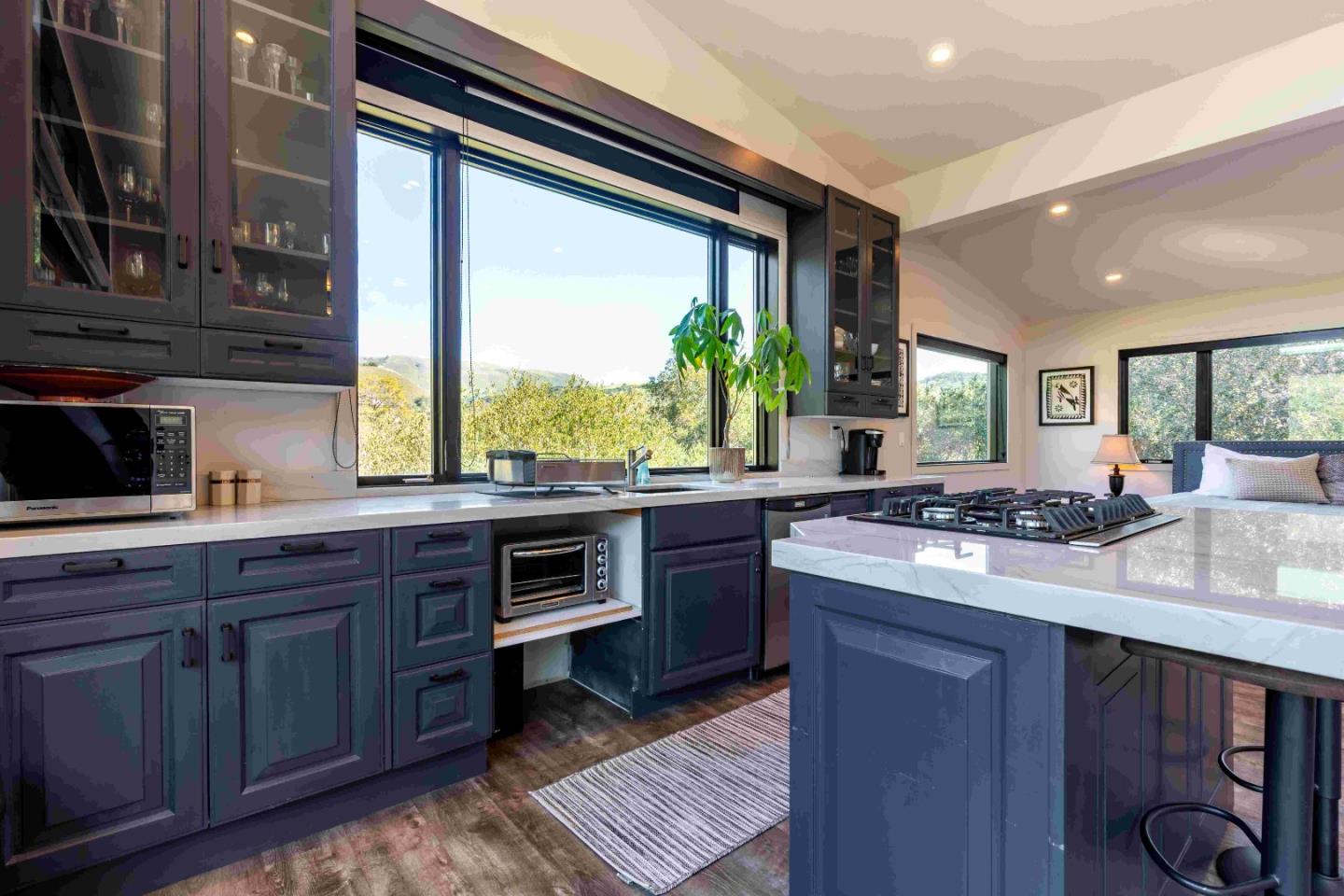 60 Los Ositos Road Carmel Valley, CA 93924 - Photo 29 of 47 a kitchen with kitchen island granite countertop a stove and a sink
