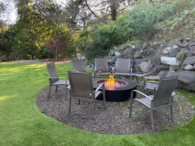 60 Los Ositos Road Carmel Valley, CA 93924 - Photo 32 of 47 a view of a backyard with sitting area