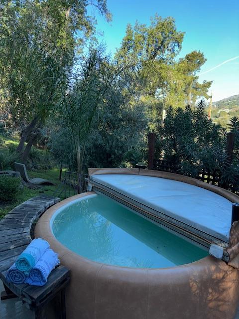 60 Los Ositos Road Carmel Valley, CA 93924 - Photo 35 of 47 a view of a backyard with swimming pool