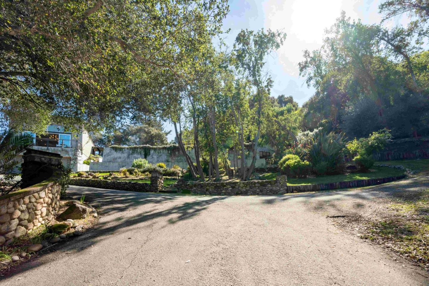 60 Los Ositos Road Carmel Valley, CA 93924 - Photo 39 of 47 a view of a parked cars in front of a building