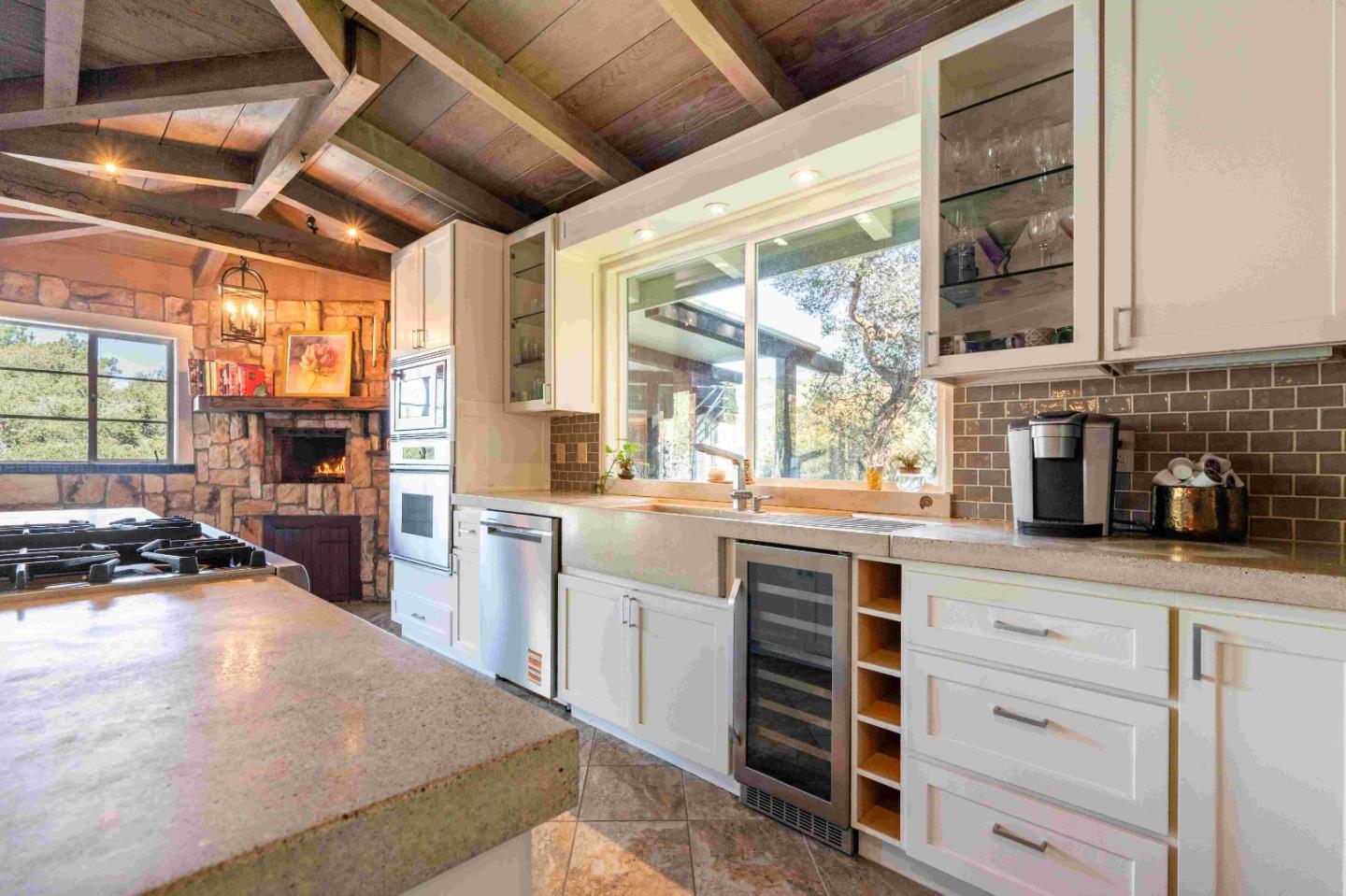 60 Los Ositos Road Carmel Valley, CA 93924 - Photo 7 of 47 a kitchen with a stove a sink and a refrigerator