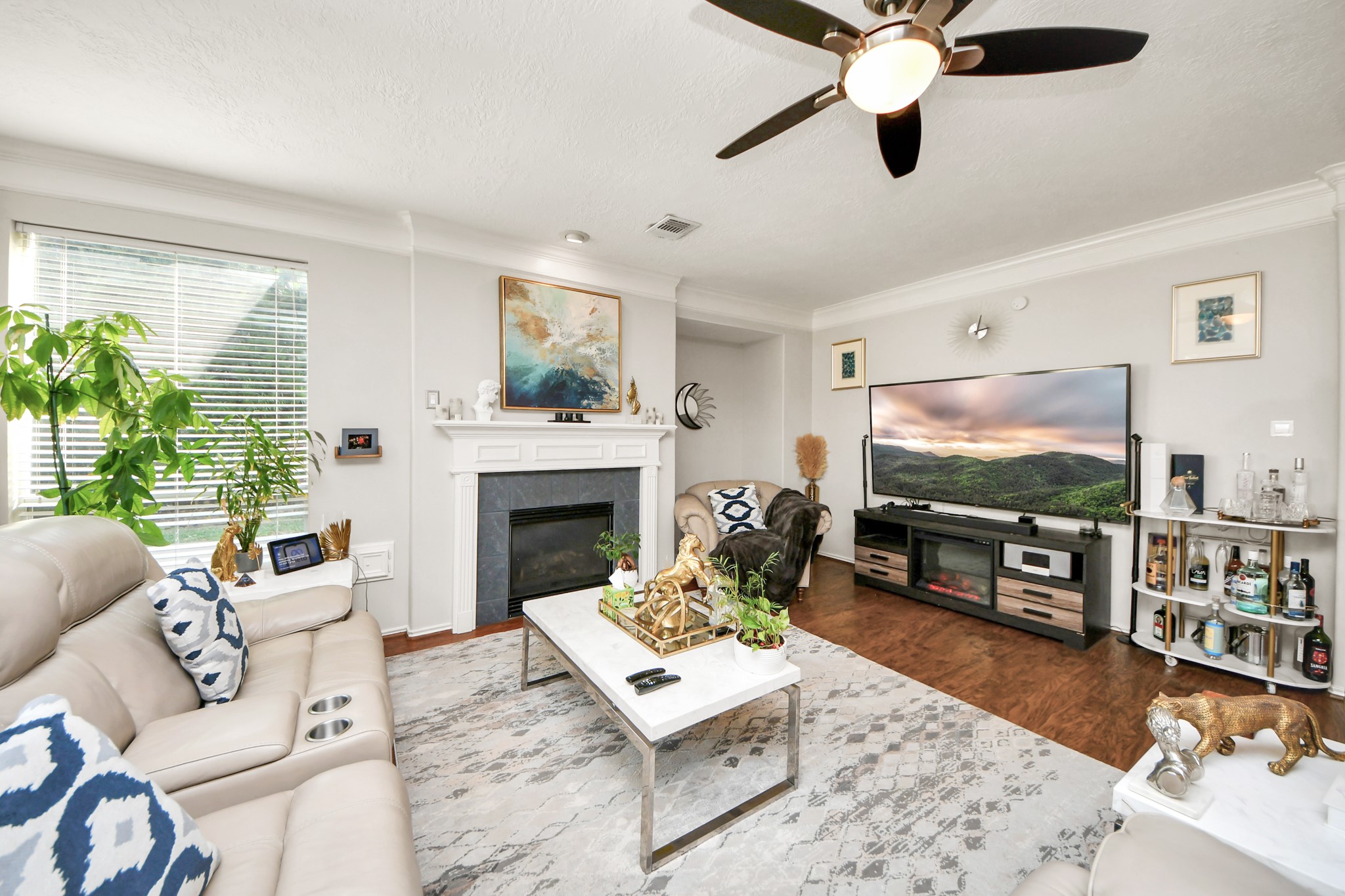 3515 Shadowside Court Houston, TX 77082 - Photo 13 of 31 a living room with furniture a flat screen tv and a fireplace