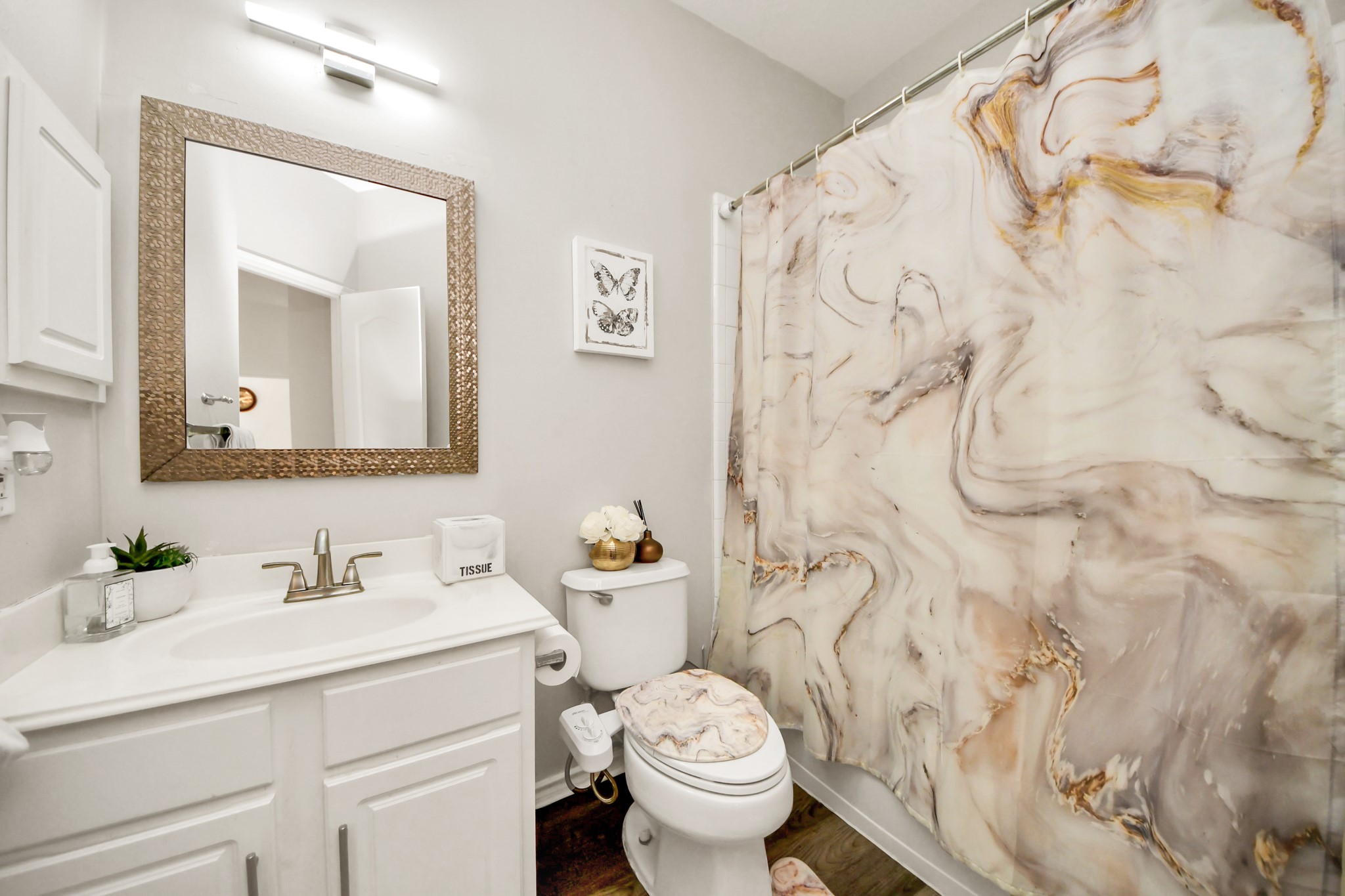 3515 Shadowside Court Houston, TX 77082 - Photo 15 of 31 a bathroom with a toilet sink and mirror