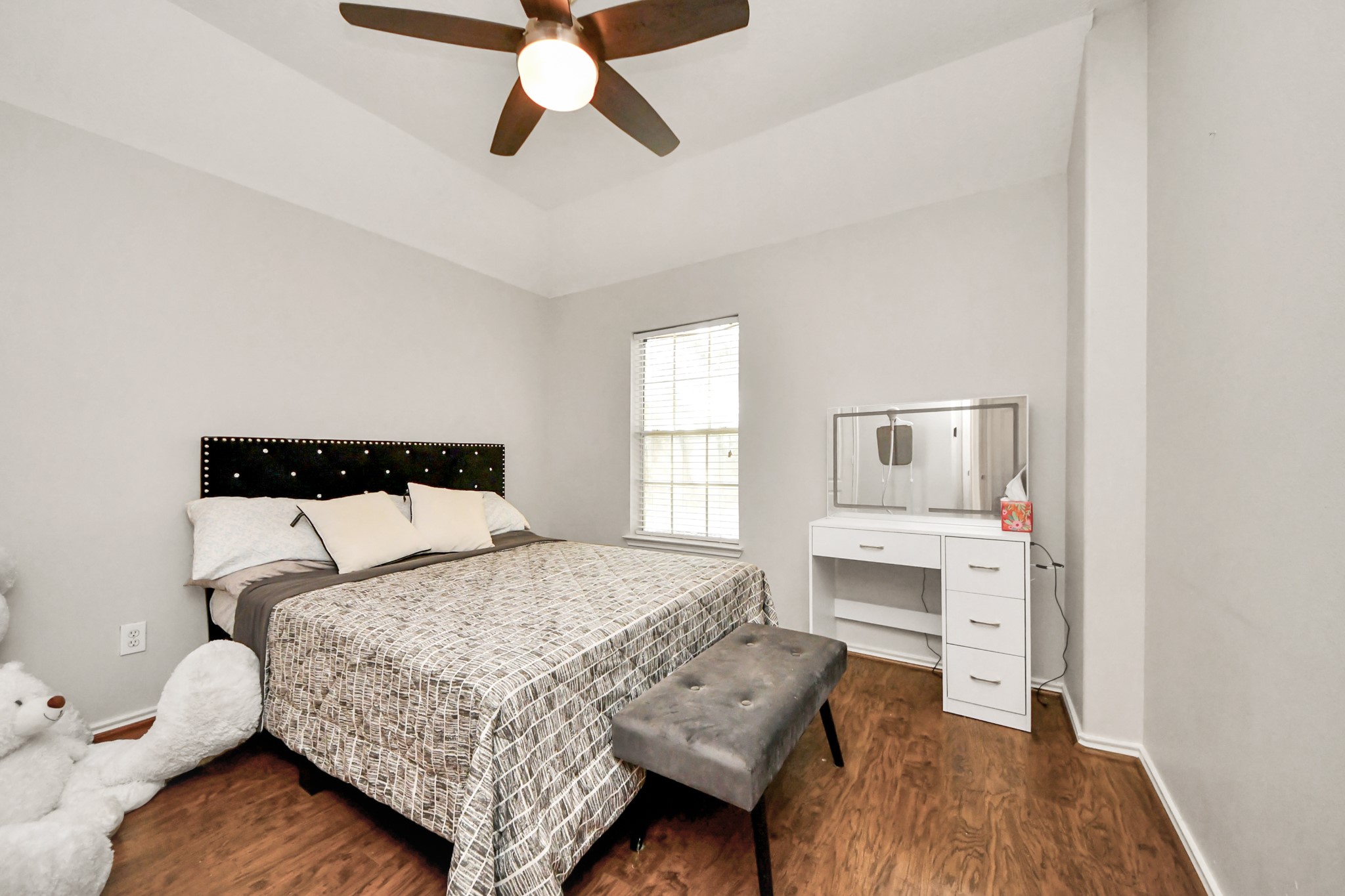 3515 Shadowside Court Houston, TX 77082 - Photo 23 of 31 a bedroom with a bed and wooden floor