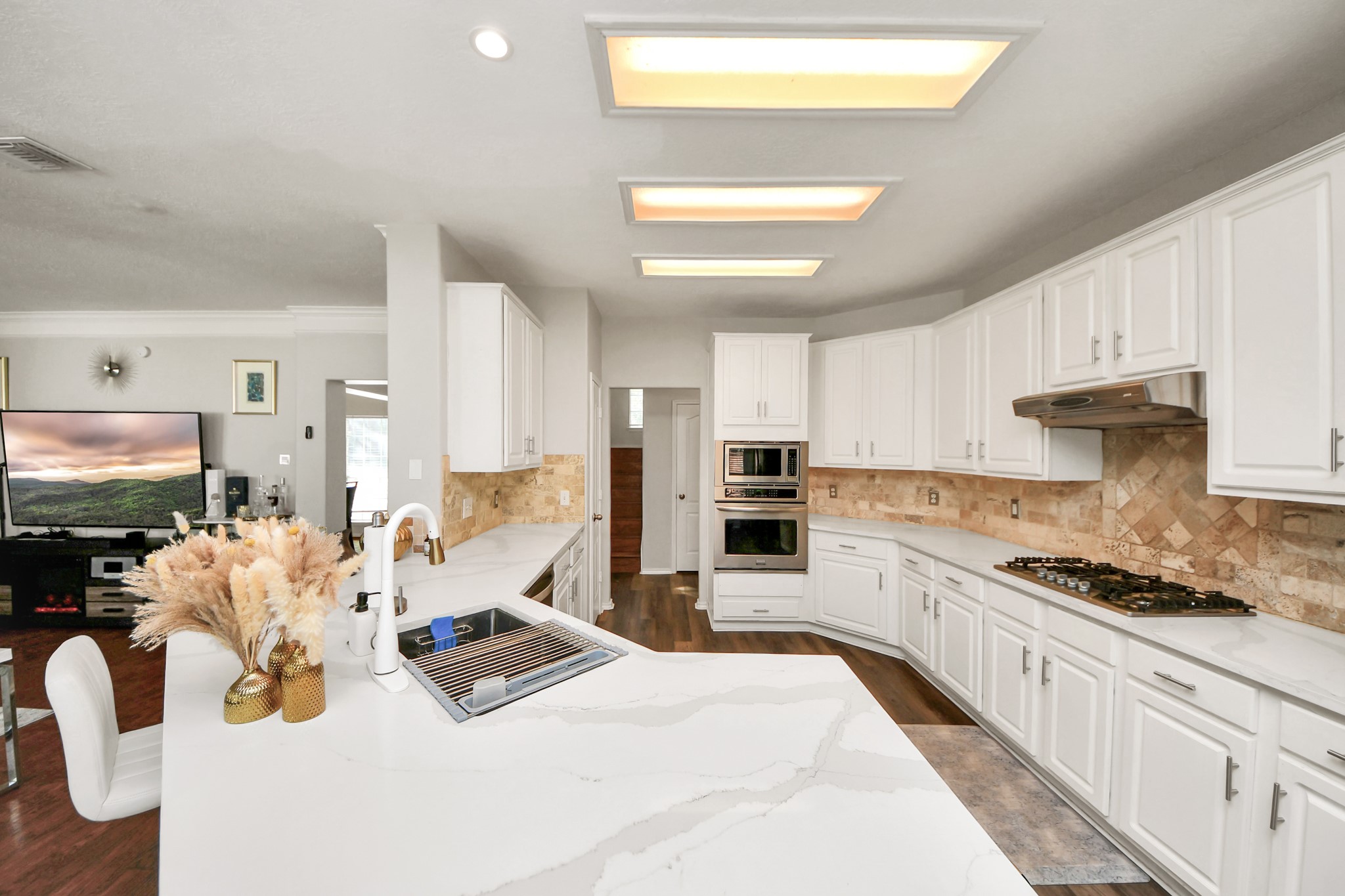 3515 Shadowside Court Houston, TX 77082 - Photo 7 of 31 a kitchen with refrigerator and cabinets