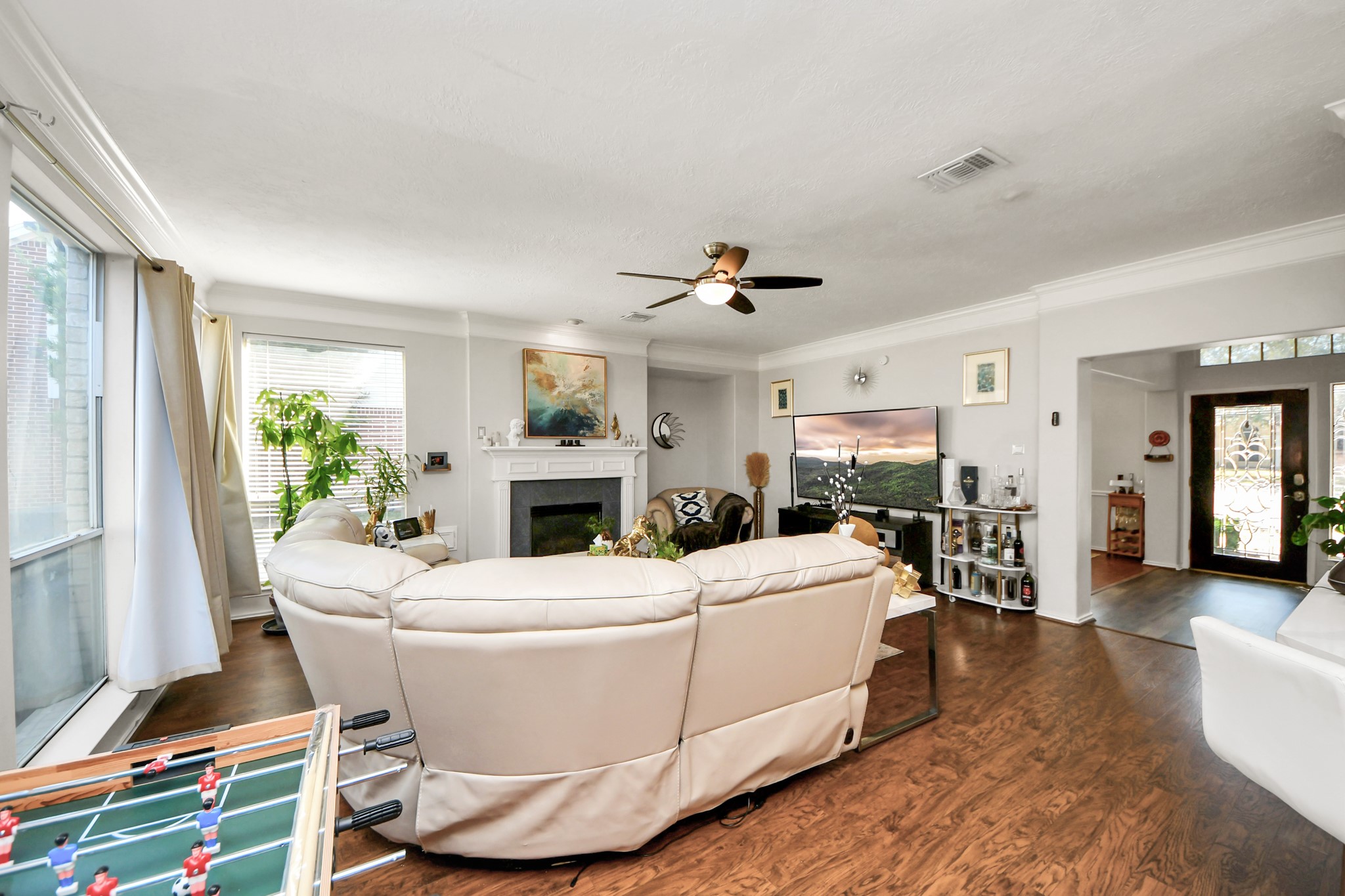 3515 Shadowside Court Houston, TX 77082 - Photo 10 of 31 a living room with furniture a fireplace and a potted plant