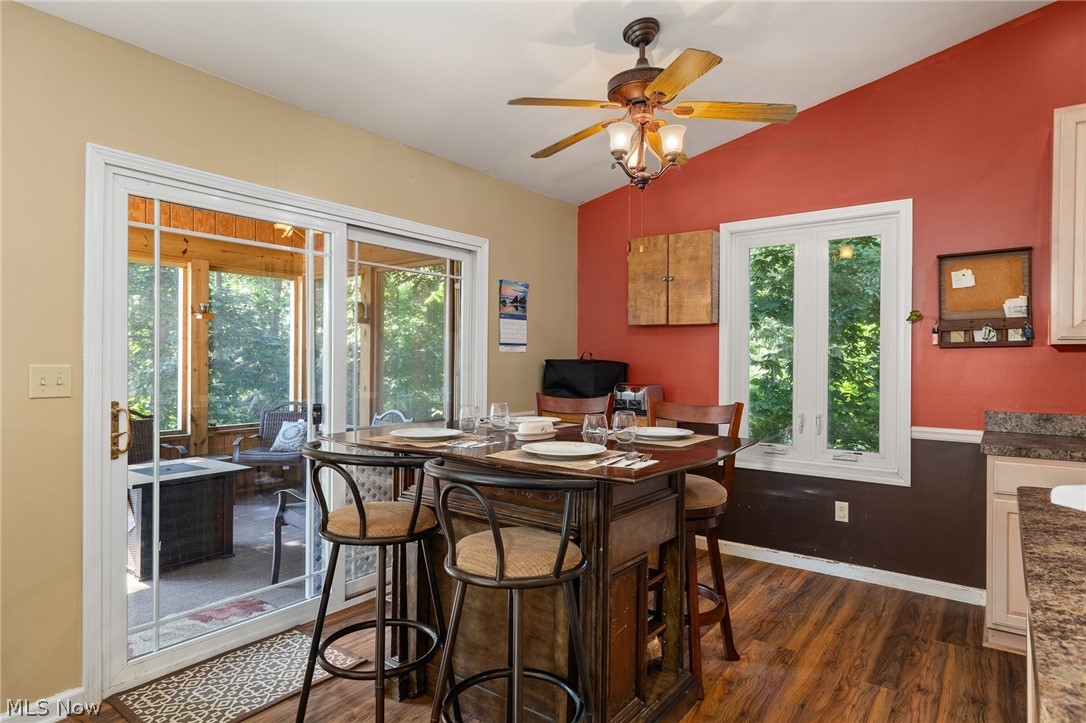 2335 South Funk Road Wooster, OH 44691 - Photo 6 of 47 Dining room with dark hardwood / wood-style flooring, ceiling fan, and lofted ceiling