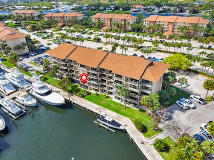 an aerial view of a house with a lake view