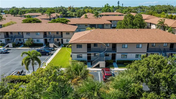 an aerial view of house with swimming pool outdoor seating and yard