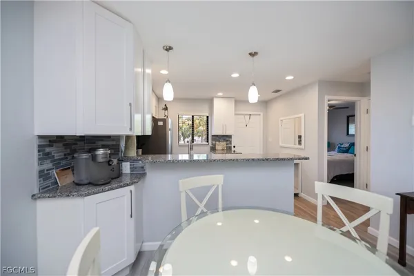 a kitchen with a sink and wooden cabinets