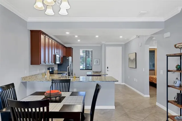 a bathroom with a granite countertop sink a mirror and a shower