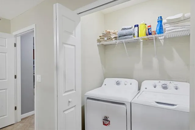 a bathroom with a granite countertop sink vanity mirror bathtub shower and a toilet