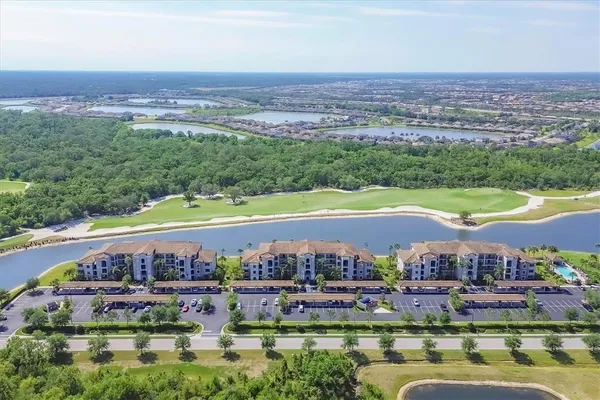 an aerial view of a city with lawn chairs
