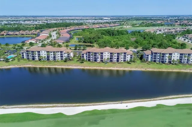 a view of a lake with a building in the background