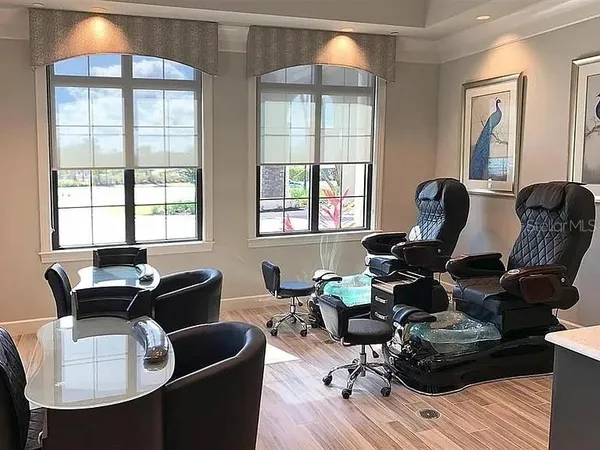 a view of a patio with a table and chairs under an umbrella