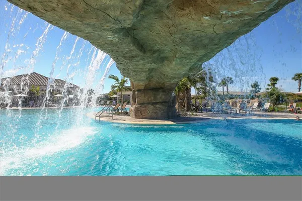 a view of a swimming pool with an outdoor seating