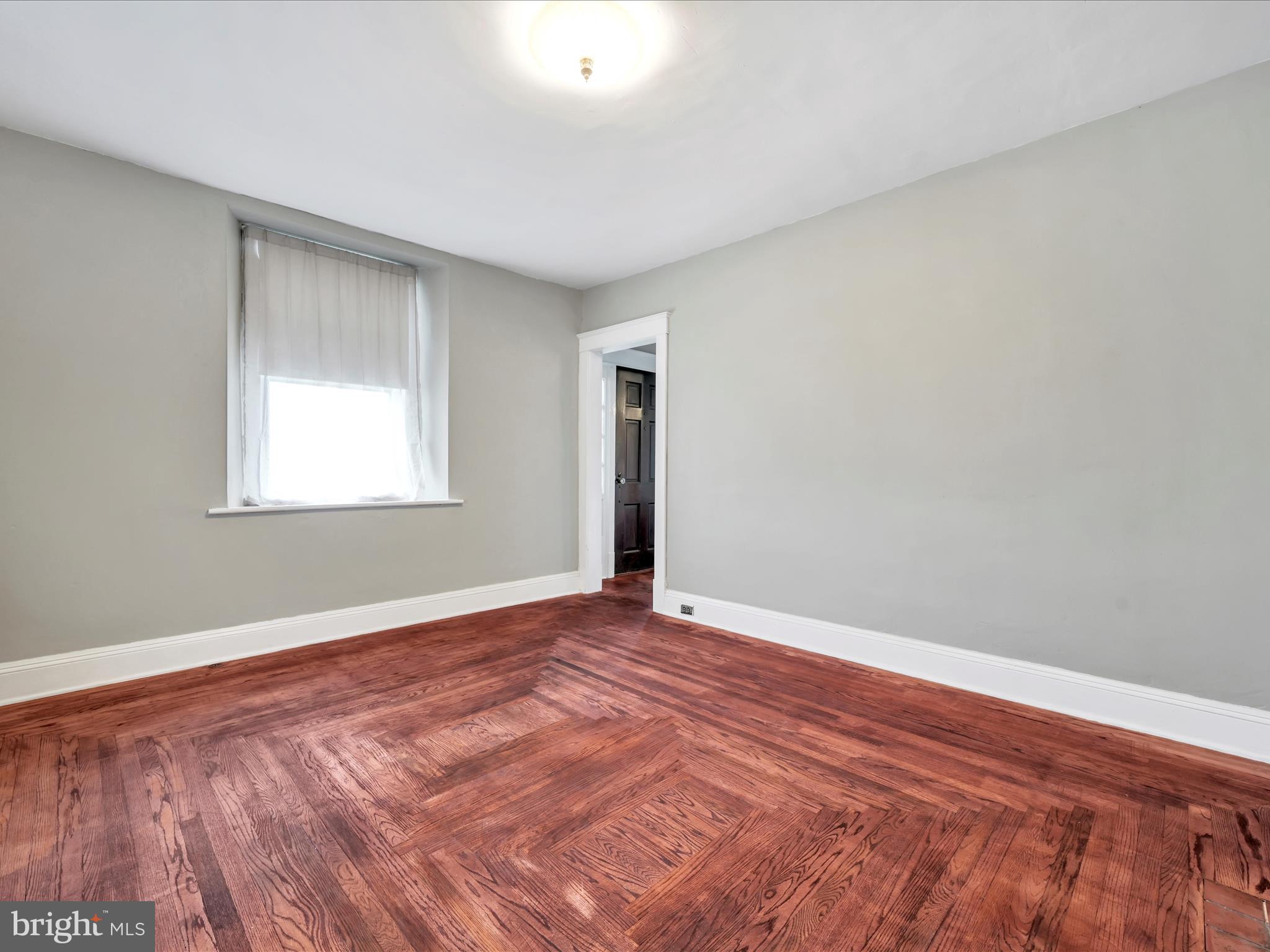 235 Biddle Street Gordon, PA 17921 - Photo 15 of 33 a view of an empty room with wooden floor and a window