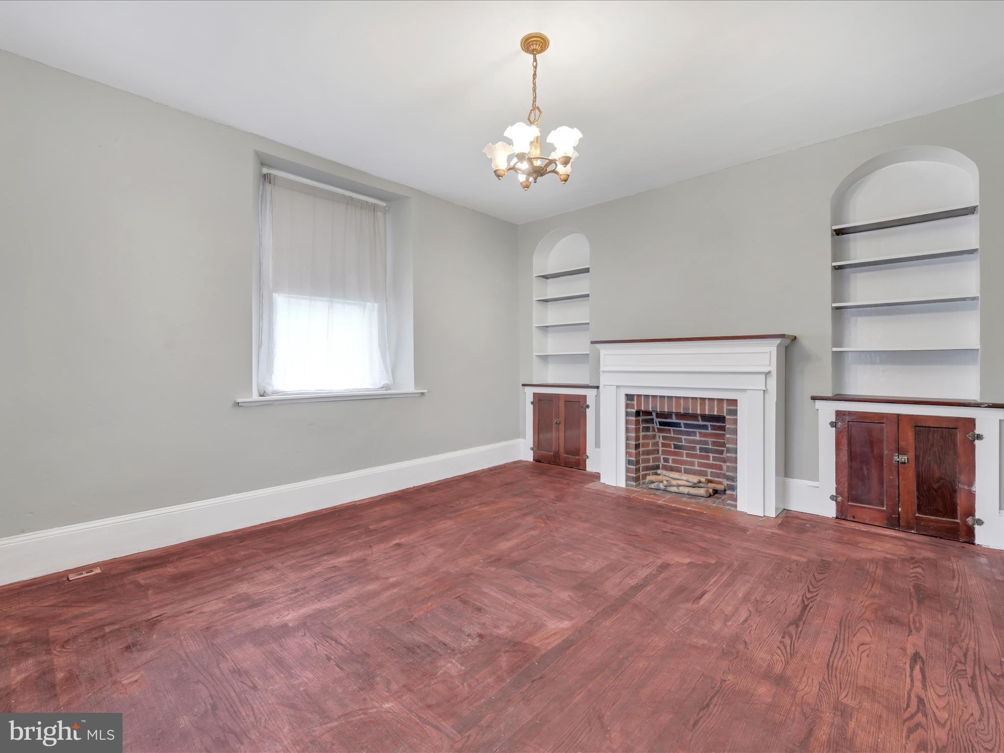 235 Biddle Street Gordon, PA 17921 - Photo 16 of 33 a view of an empty room with a fireplace and a window