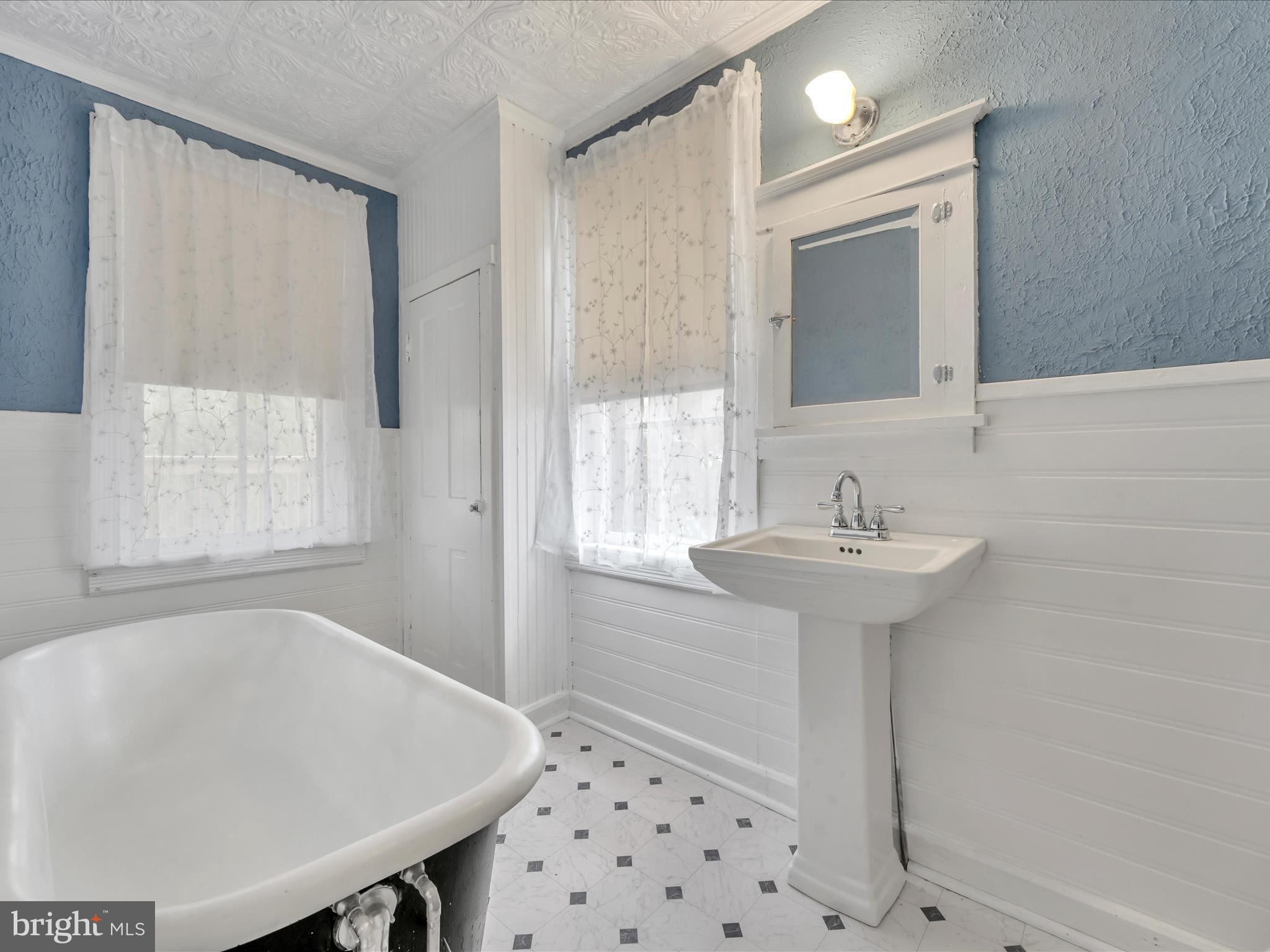 235 Biddle Street Gordon, PA 17921 - Photo 26 of 33 a bathroom with a sink a bath tub and shower