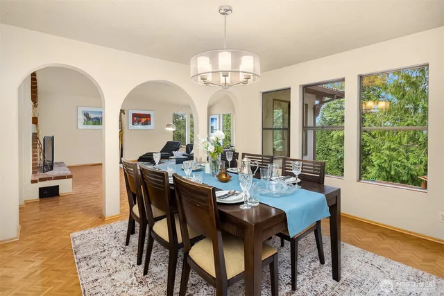 a view of a dining room with furniture window and wooden floor