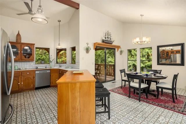 a dining room with granite countertop a couch and chairs