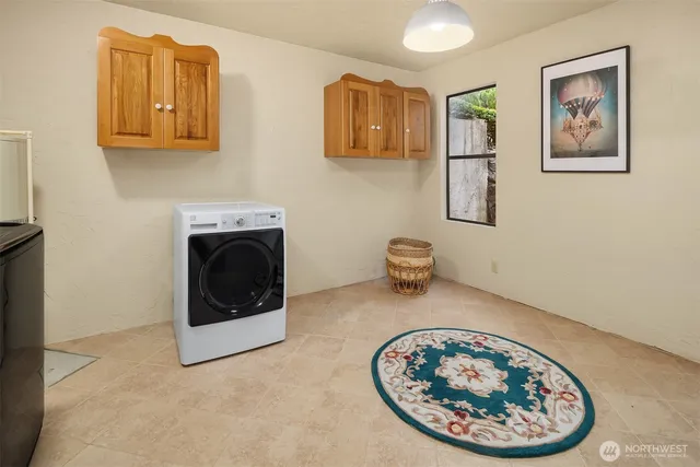 a view of a hallway with washer and dryer