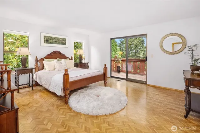 a spacious bedroom with a bed and a table