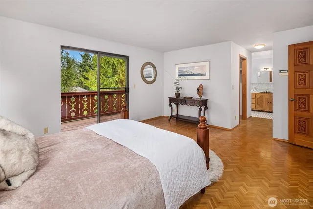 a bedroom with a bed and a table in it