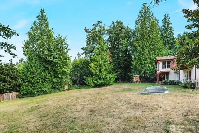 a front view of a residential apartment building with a yard