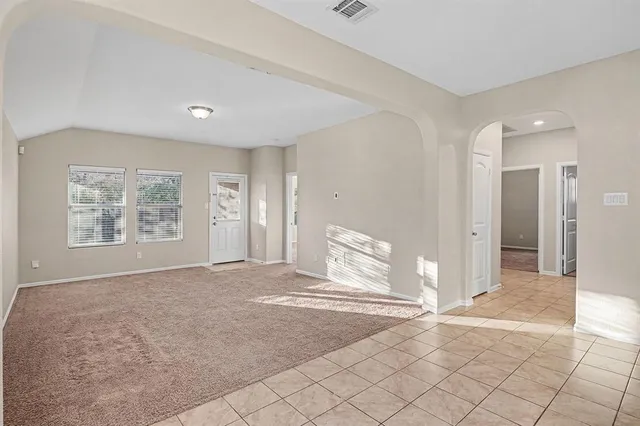 a view of livingroom with an empty space and window
