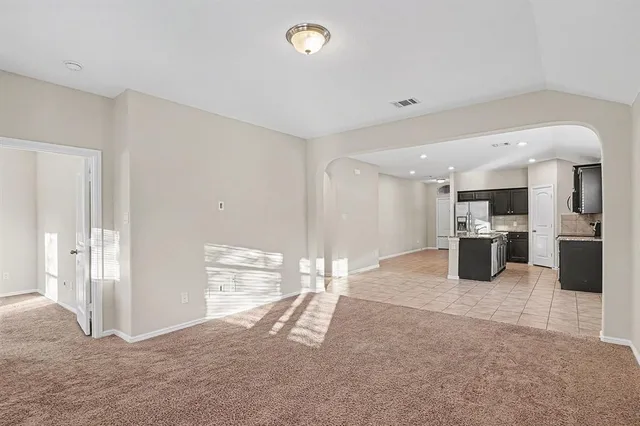 a room with gym equipment and a large window