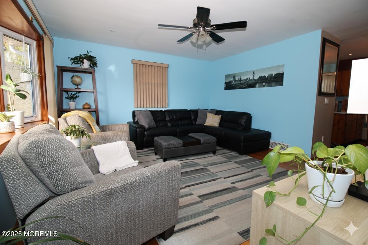 60 Shell Street Beachwood, NJ 08722 - Photo 4 of 24 a living room with furniture and a flat screen tv