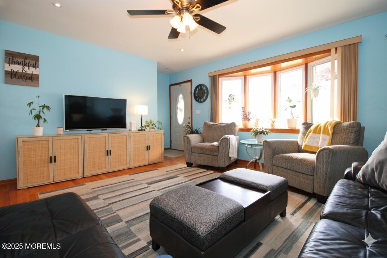 60 Shell Street Beachwood, NJ 08722 - Photo 5 of 24 a living room with furniture and a flat screen tv