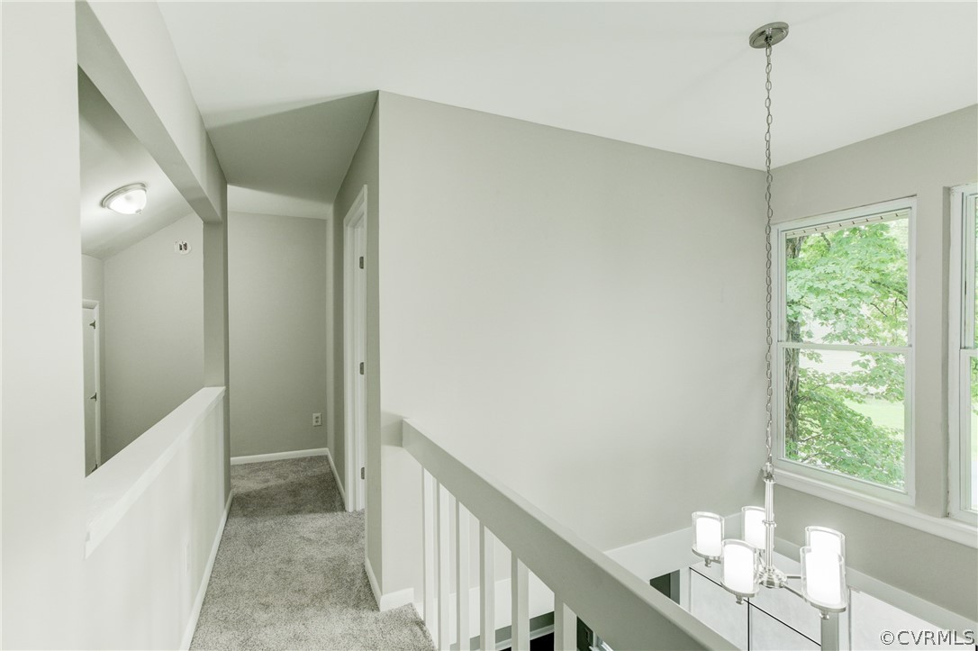 15820 Tri Gate Road Chester, VA 23831 - Photo 16 of 29 a view of hallway with window and wooden floor