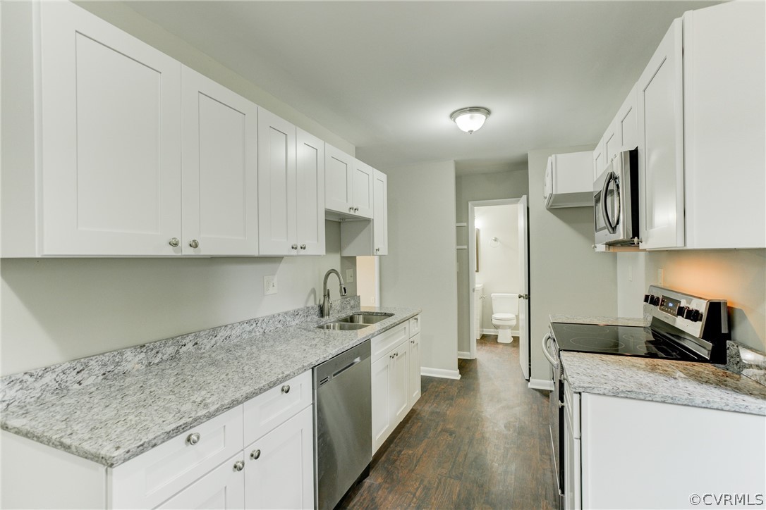 15820 Tri Gate Road Chester, VA 23831 - Photo 3 of 29 a kitchen with stainless steel appliances granite countertop a sink stove and refrigerator
