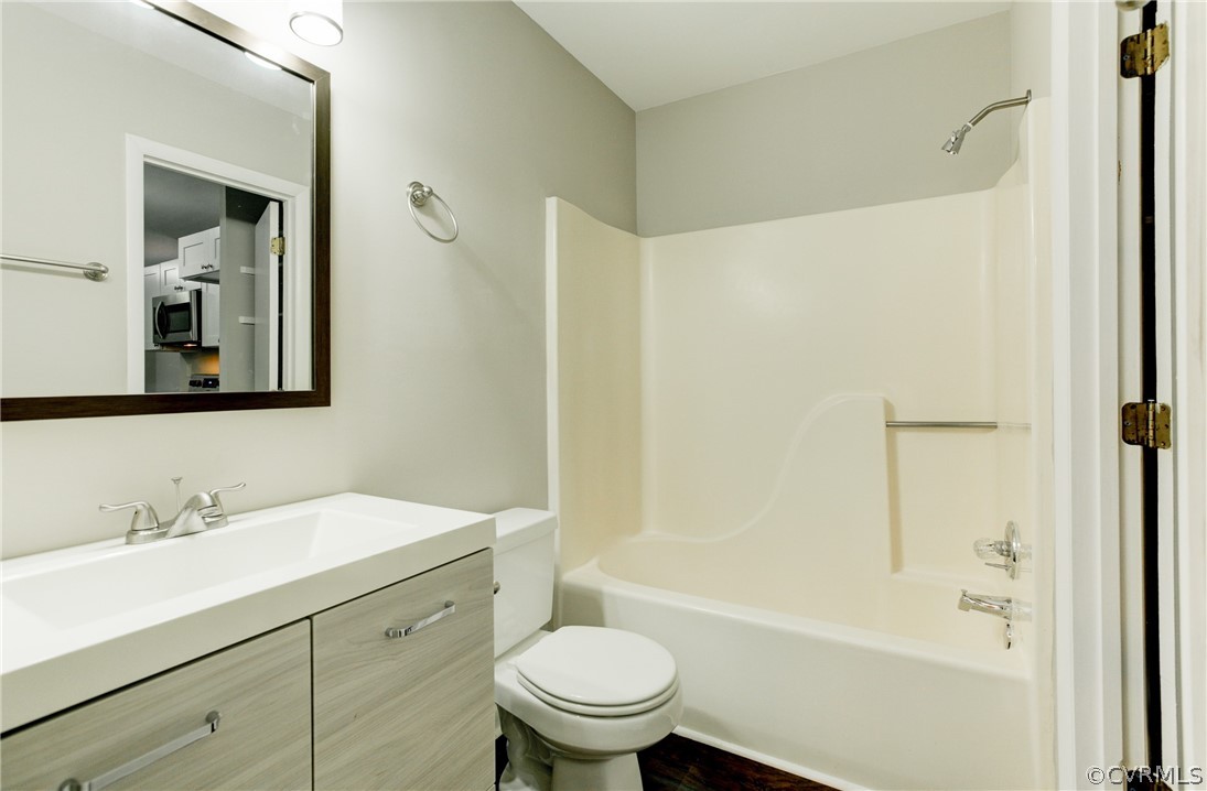 15820 Tri Gate Road Chester, VA 23831 - Photo 10 of 29 a bathroom with a sink a toilet and shower