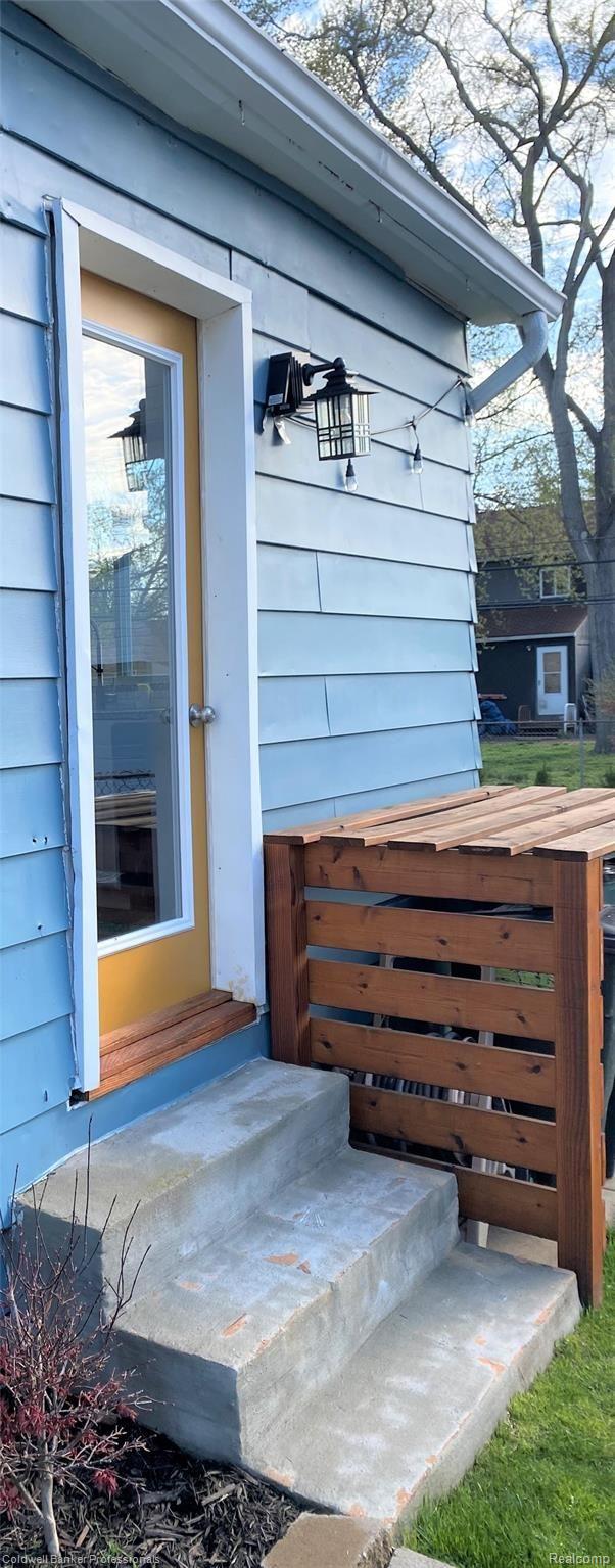 1930 Leitch Road Ferndale, MI 48220 - Photo 22 of 39 side door providing access to back yard and showing place for trash cans