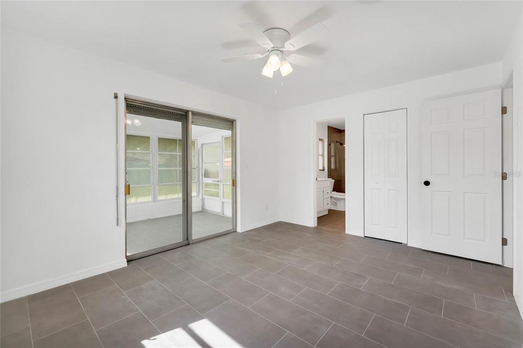 448 Ridge Drive Sanford, FL 32773 - Photo 9 of 20 an empty room with fan and entrance